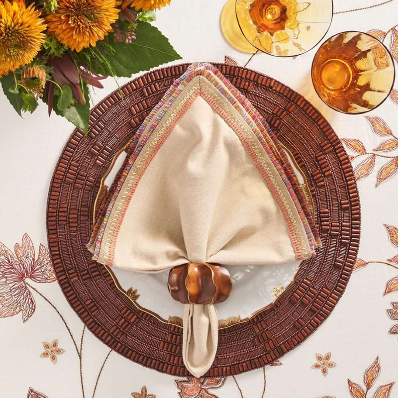 Wood Matrix placemat in brown by Kim Seybert styled with organic napkin.