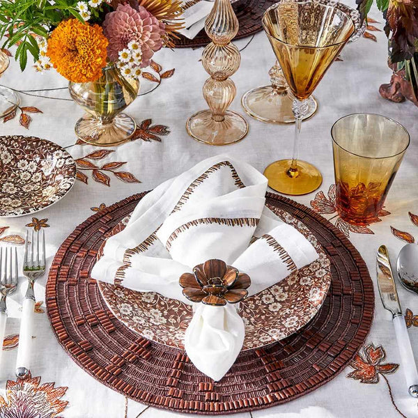 Wood Matrix placemat in brown by Kim Seybert styled with wood napkin ring.