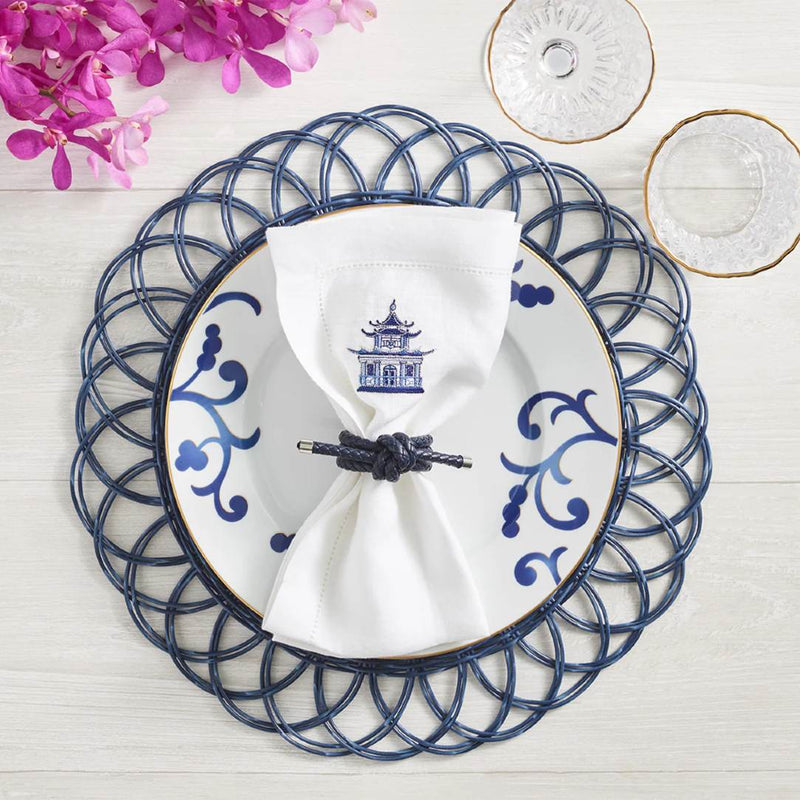 Blue faux rattan scalloped placemat by Kim Seybert on nautical table setting.