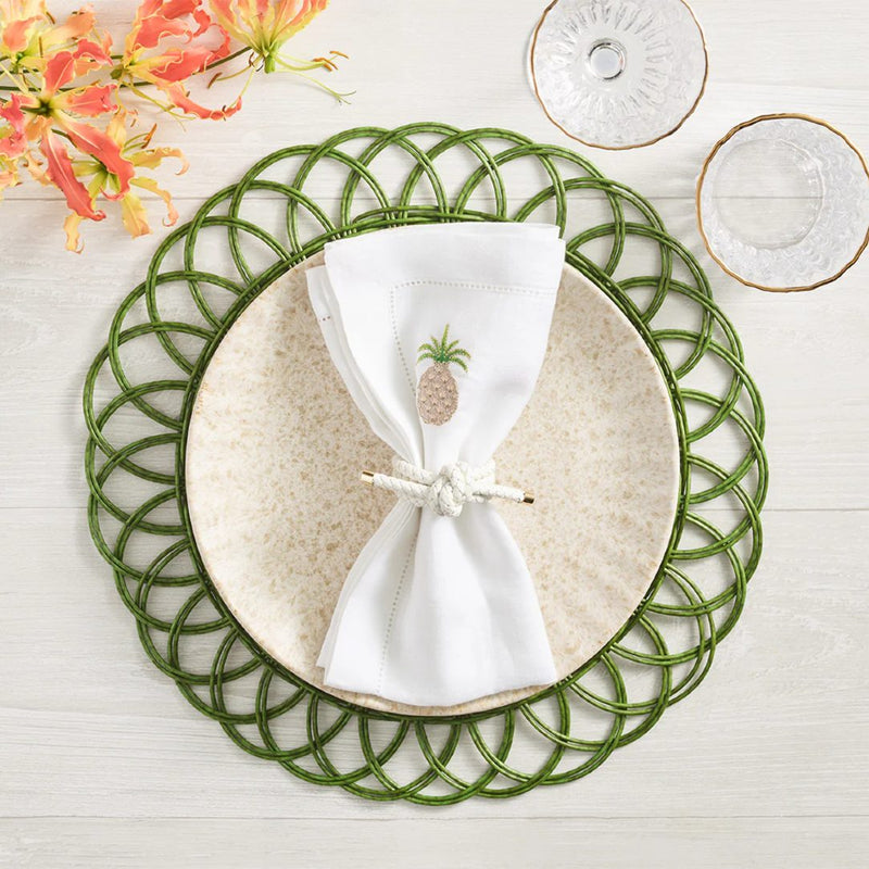 Alfresco Placemats in green with handwoven texture styled with white napkin and napkin ring.