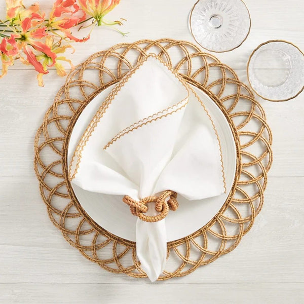 Natural Alfresco placemat in handwoven faux rattan by Kim Seybert with brown napkin ring.