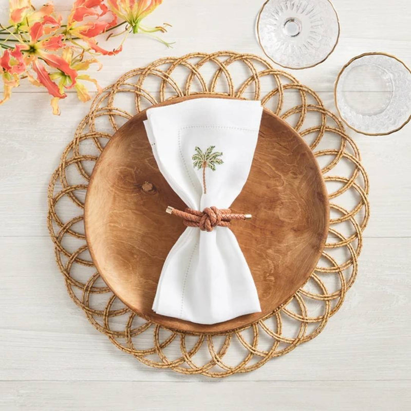 Natural Alfresco placemat in handwoven faux rattan by Kim Seybert with white napkin.