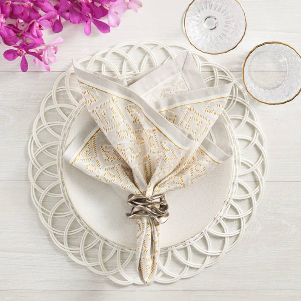 Luxury white faux rattan Alfresco placemat by Kim Seybert with elegant napkin.
