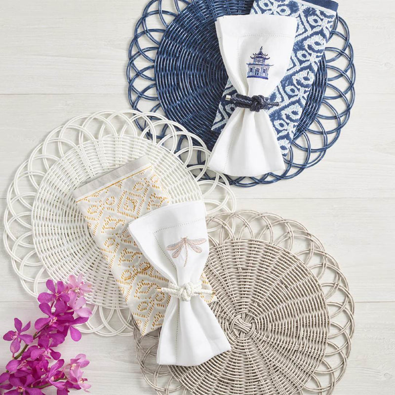 Faux rattan Alfresco placemat with scalloped edges by Kim Seybert in three different colours.