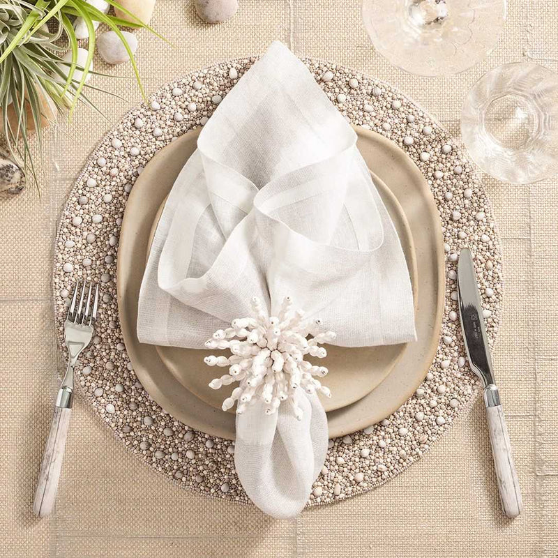 Gray and taupe Zen placemat with wood and glass bead detailing by Kim Seybert styled.