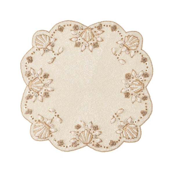 Beachcomber placemat with mother-of-pearl and gold shell accents by Kim Seybert.
