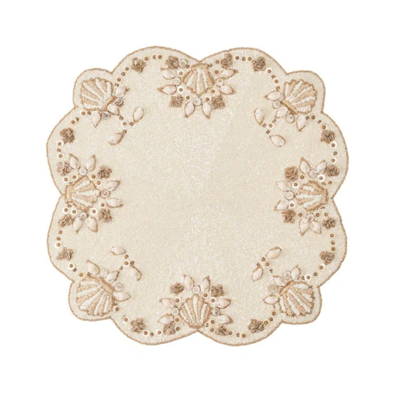 Beachcomber placemat with mother-of-pearl and gold shell accents by Kim Seybert.