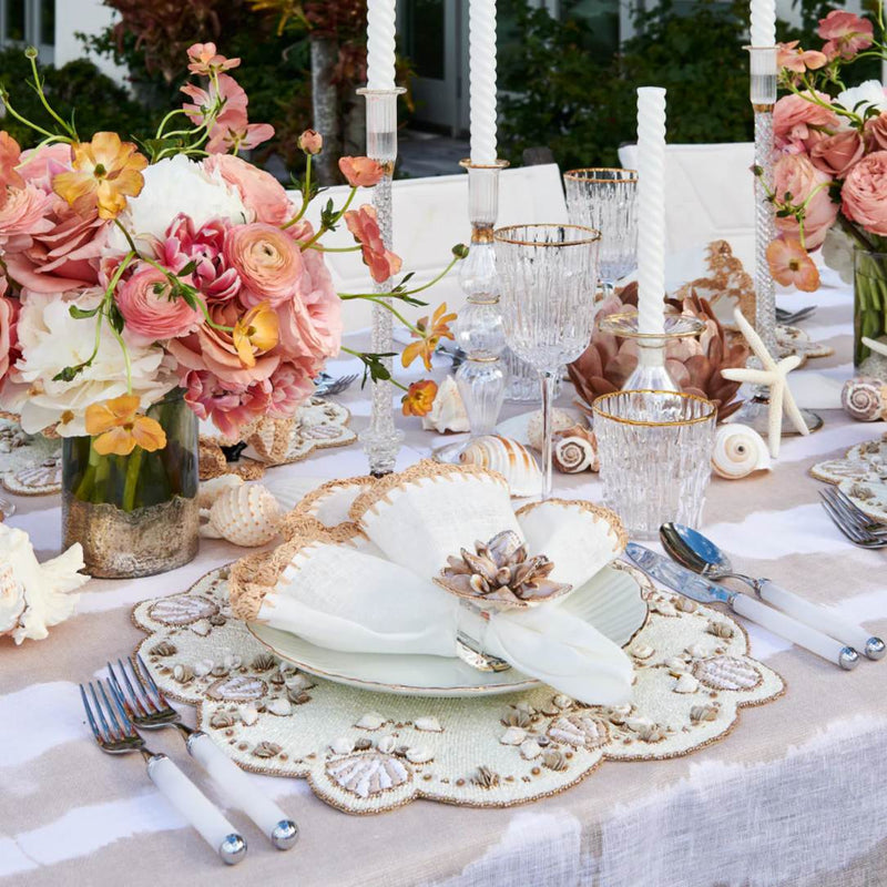 Beachcomber placemat by Kim Seybert on luxury coastal tablescape.
