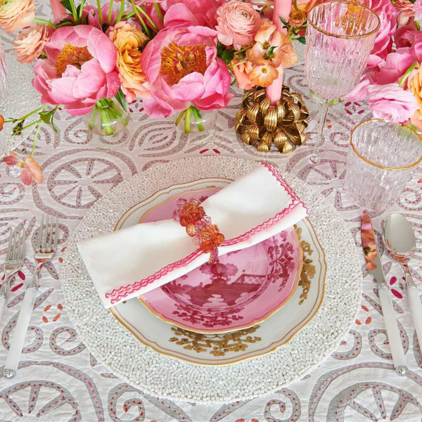 Luxury white beaded Perennial placemat with vermicelli pattern by Kim Seybert side view.