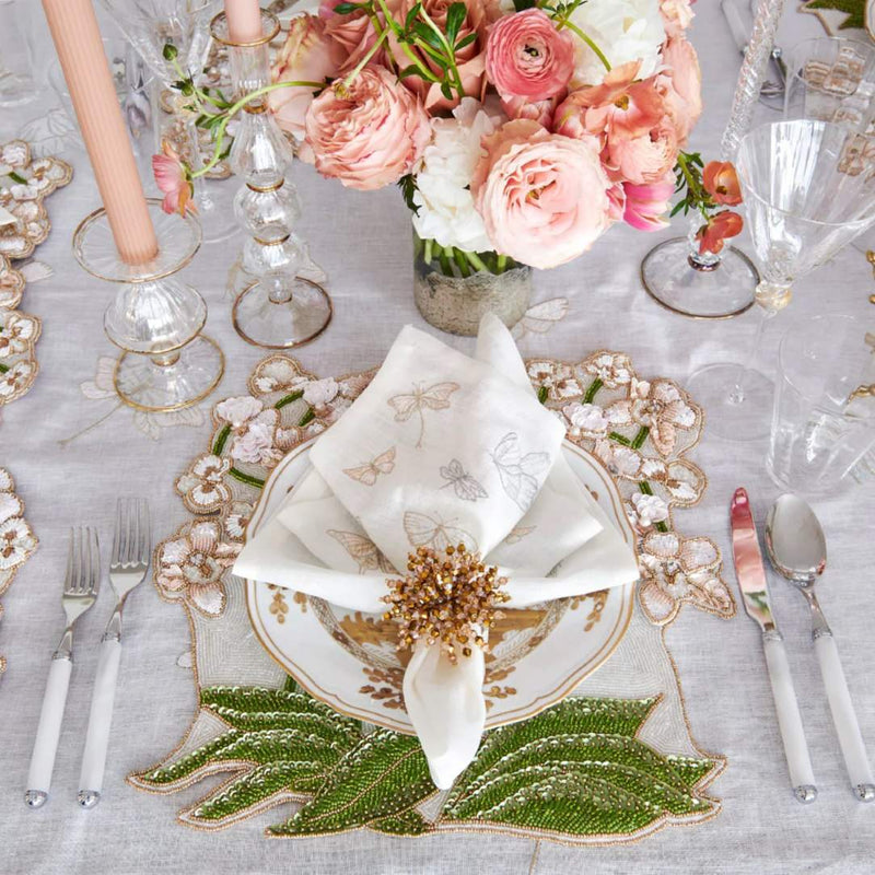 Luxury Orchid placemat in multi, styled on an elegant dining table.