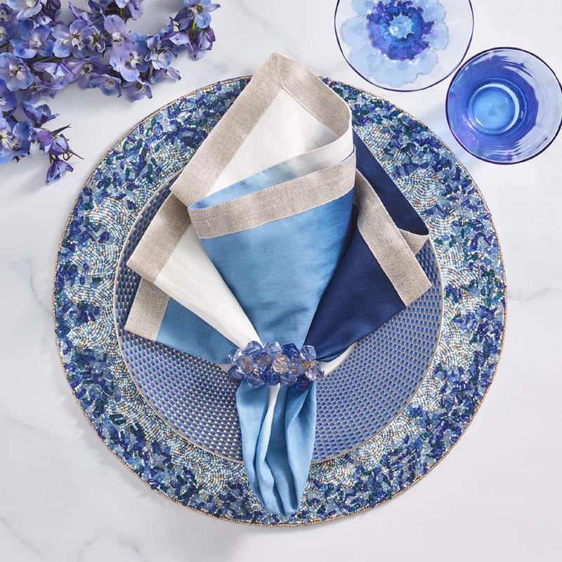 Lagoon Placemat hand-beaded in navy and blue tones with blue ombre napkin.