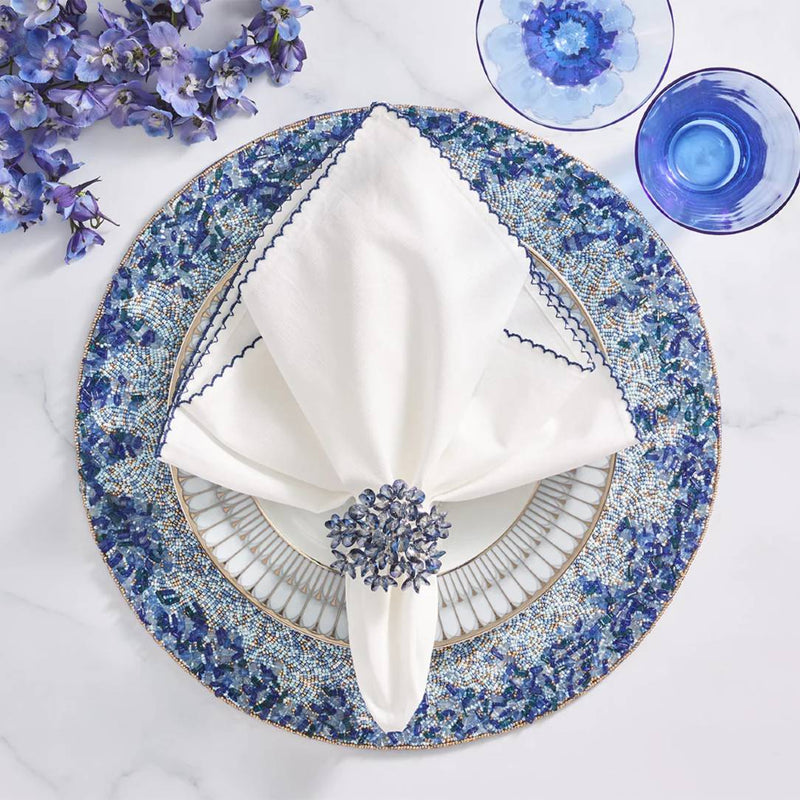 Lagoon Placemat hand-beaded in navy and blue tones styled with sparkle blue napkin ring.