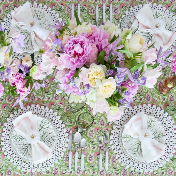Luxury white round bamboo placemat with organic texture by Kim Seybert on floral tablescape.