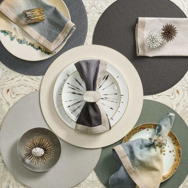 Pearl faux shagreen round placemat with refined texture by Kim Seybert in different colours.
