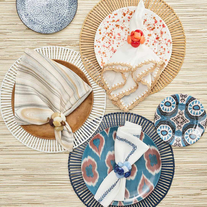 Brown Spoke bamboo placemat in hand-cut geometric design by Kim Seybert in three different colours.