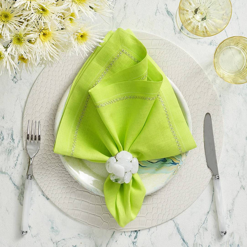 White croco placemat with embossed texture by Kim Seybert styled with green napkin
