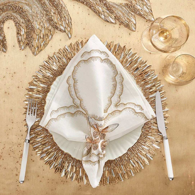 Kim Seybert Ray placemat in gold and crystal sequins with gold dragonfly napkin ring.