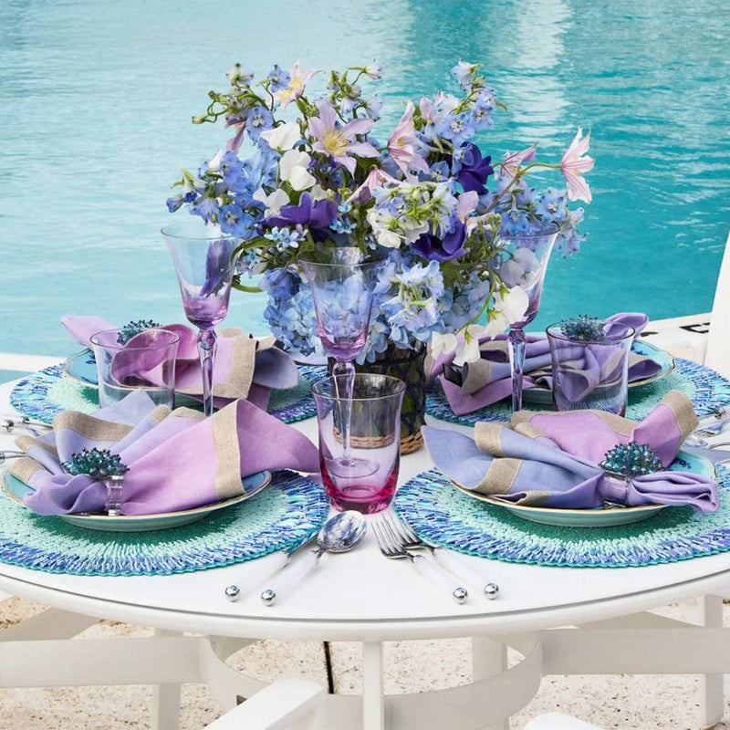 Periwinkle and seafoam beaded ombre placemat with radiant sequins on summer outdoor tablescape.