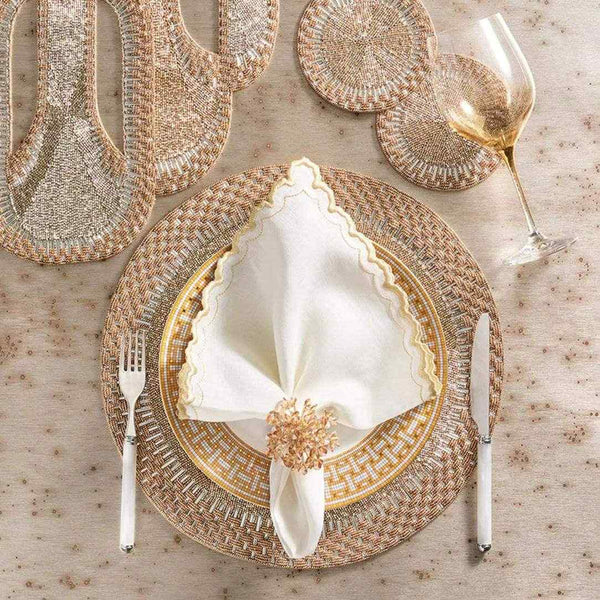 Luxury round placemat in gold and silver beadwork styled with matching runner and coasters.