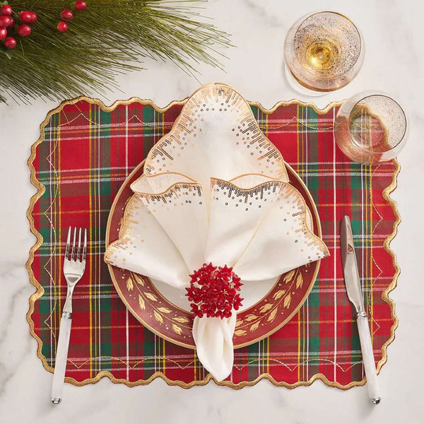 Red tartan placemat with gold embroidered scalloped edge styled with sparkle red napkin ring.