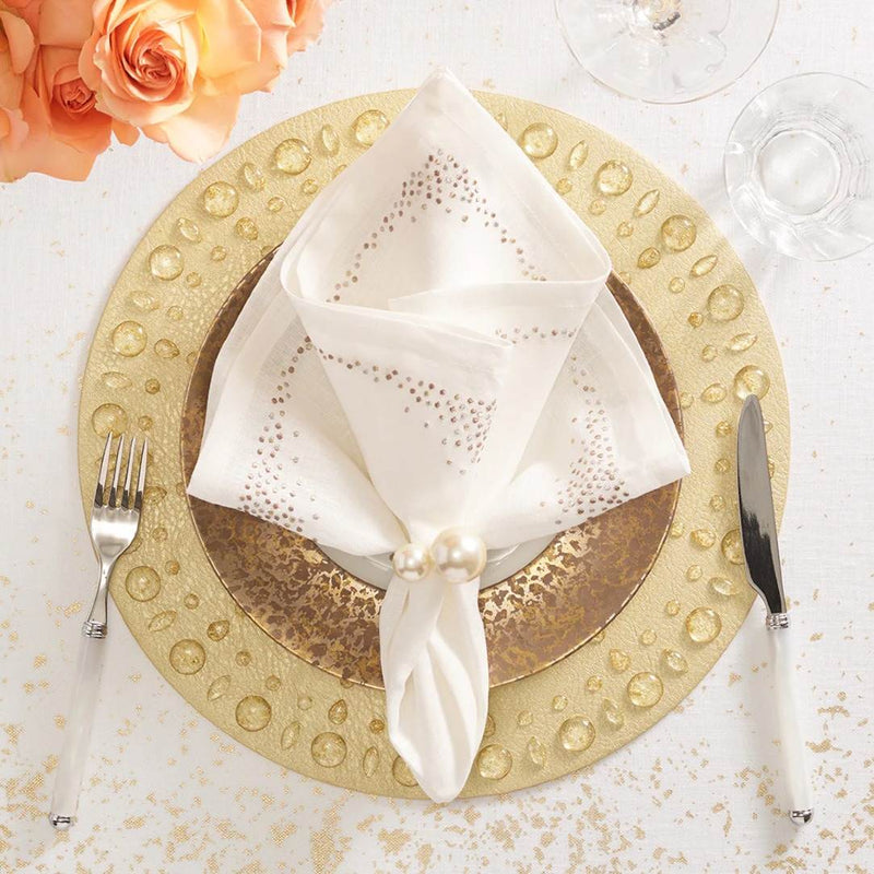 Gold Dew Drops placemat with resin gemstone border by Kim Seybert styled with pearl napkin ring.