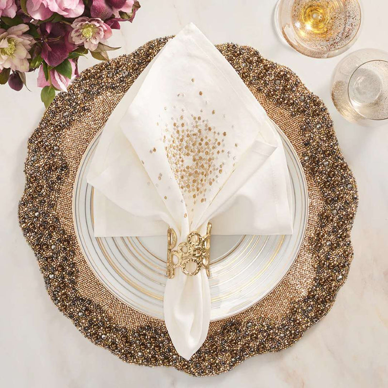 Kim Seybert Enigma placemat in gold and gunmetal beads with gold napkin ring.