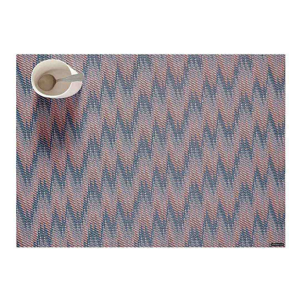Rectangular Chilewich Flare placemat in sunrise tones on white background.