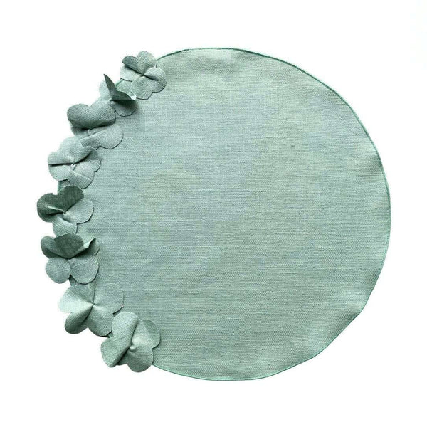 Sage green round linen placemat with 3D applied flowers by Giardino Segreto.