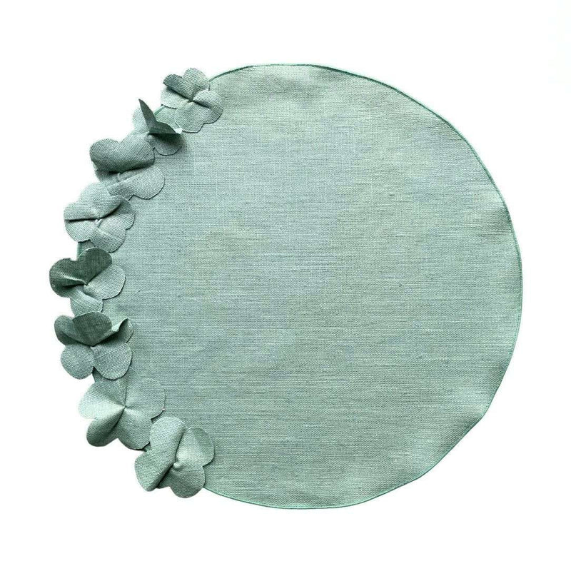 Sage green round linen placemat with 3D applied flowers by Giardino Segreto.