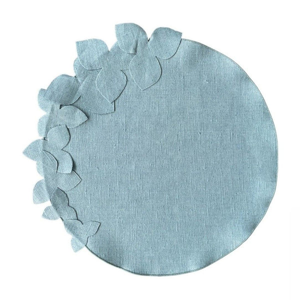 Sky blue round linen placemat with 3D hydrangea flowers by Giardino Segreto.