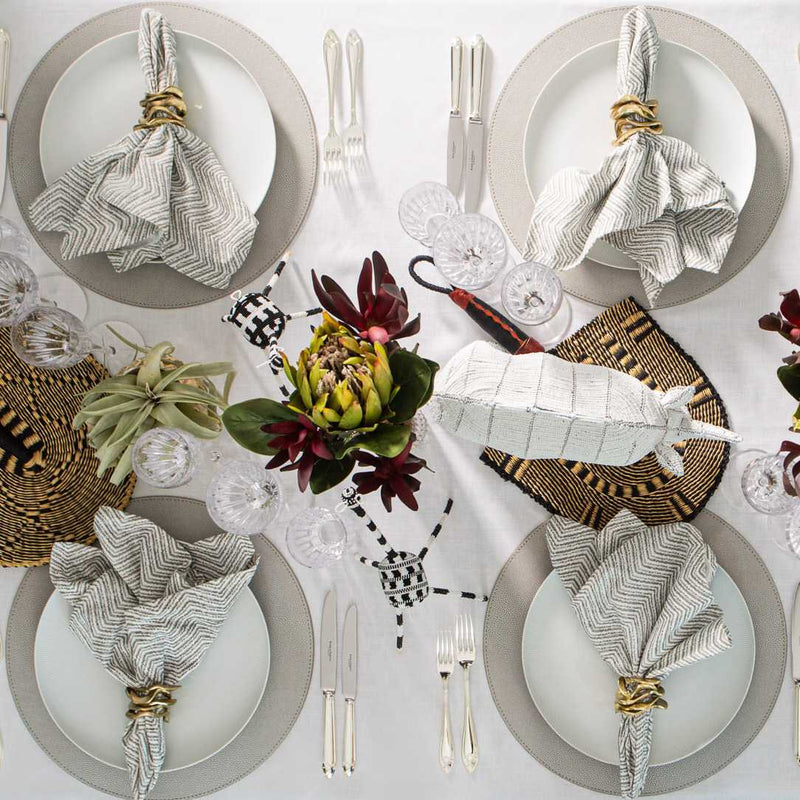 Grey faux shagreen placemat with textured finish by Kim Seybert styled african themed tablescape.
