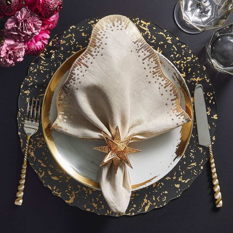 Clear acrylic placemat with gold flecks and wavy edge by Kim Seybert top view.