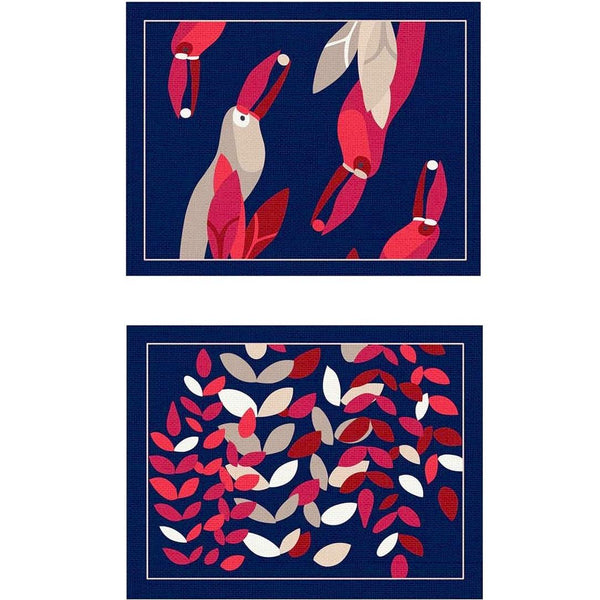Reversible placemat with tropical foliage motif and toucan design by Alto Duo.