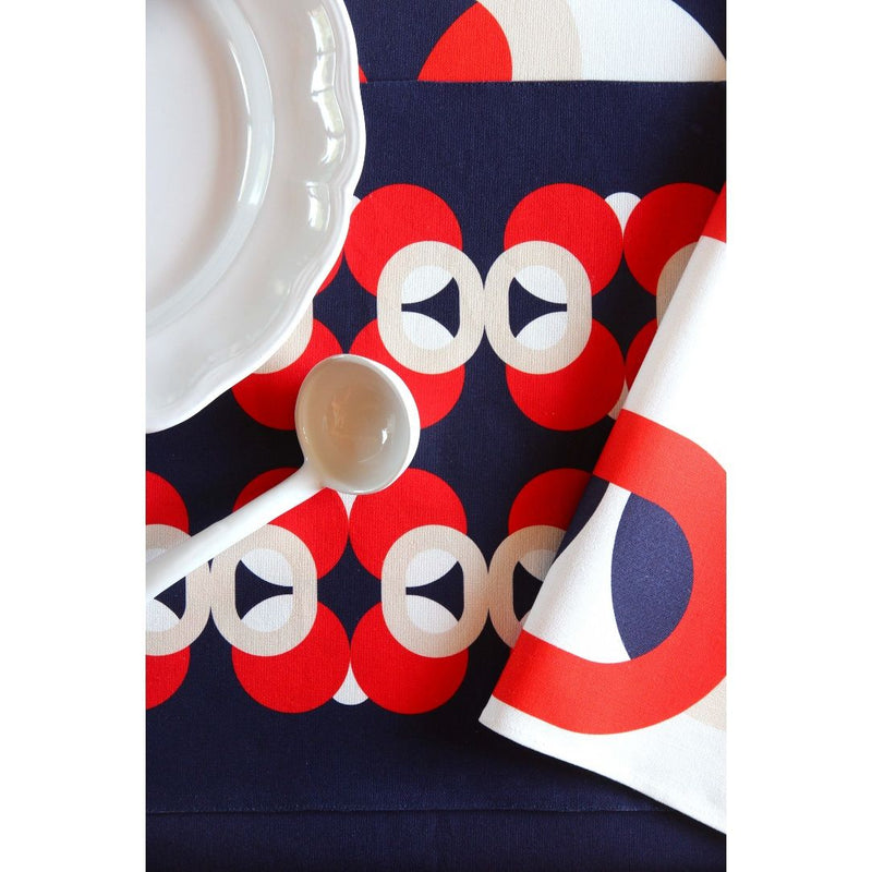 Reversible placemat with palm tree motif and vase design close-up.