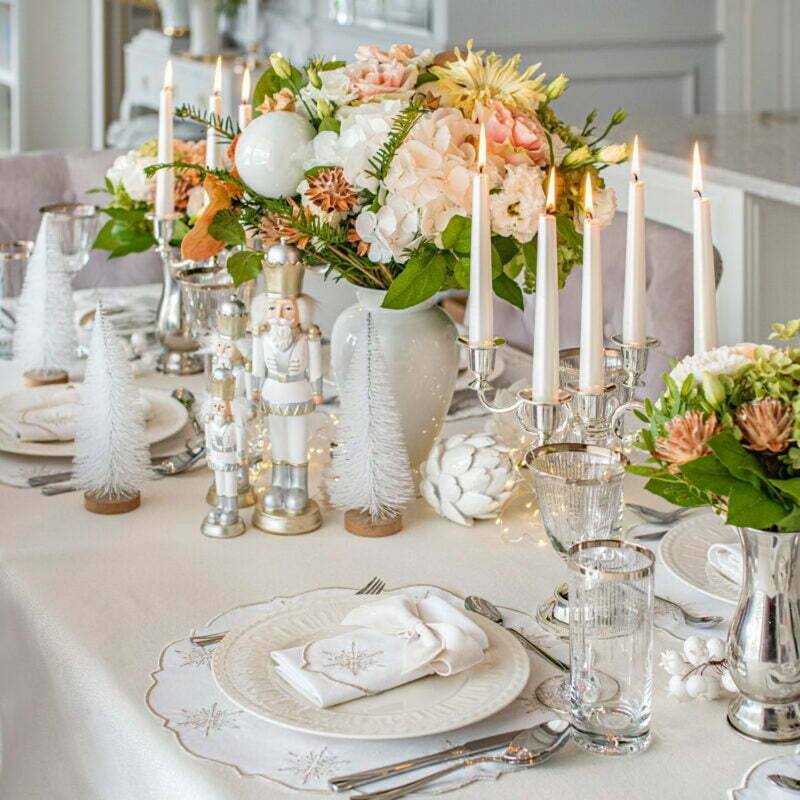 Round cotton placemat with silver star embroidery by Roseberry Home on luxury Christmas table setting.