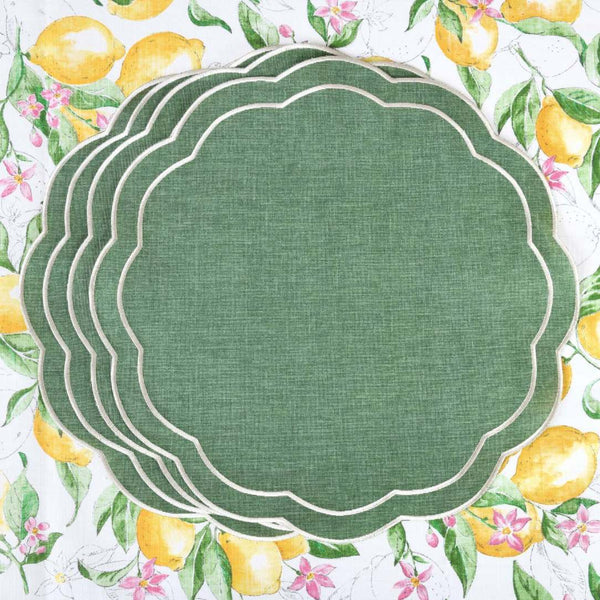 Emerald green embroidered placemats with petal shape by Roseberry Home on lemon tablecloth.