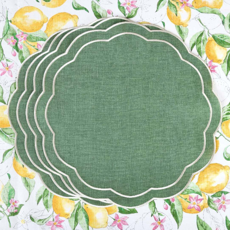 Emerald green embroidered placemats with petal shape by Roseberry Home on lemon tablecloth.