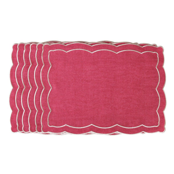 Pink placemat with ecru embroidery and irregular wave border by Roseberry Home.