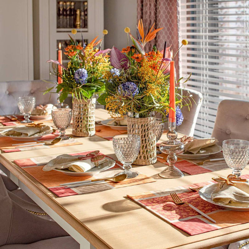 Orange cotton placemat with acrylic coating on luxury autumnal tablescape.