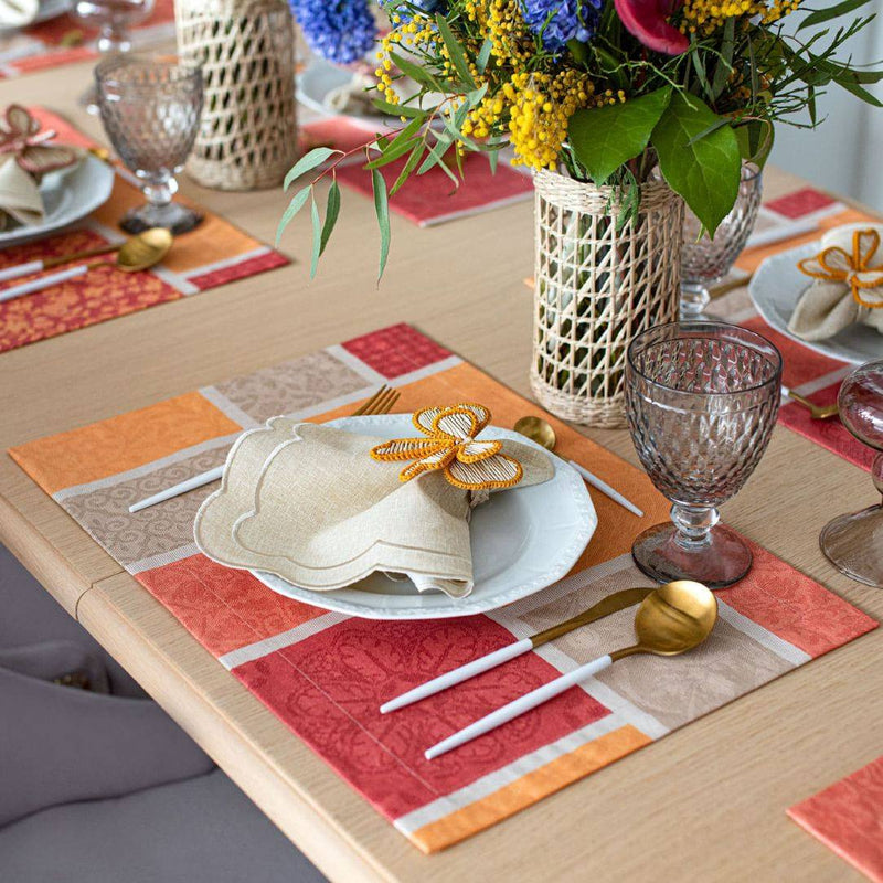 Orange cotton placemat with acrylic coating styled on fall tablescape.