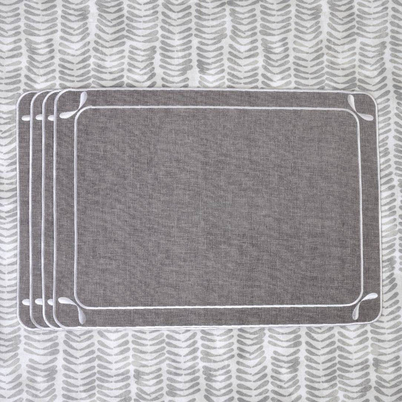 Gray fabric placemat with embroidered dragonfly wings motif set of six.