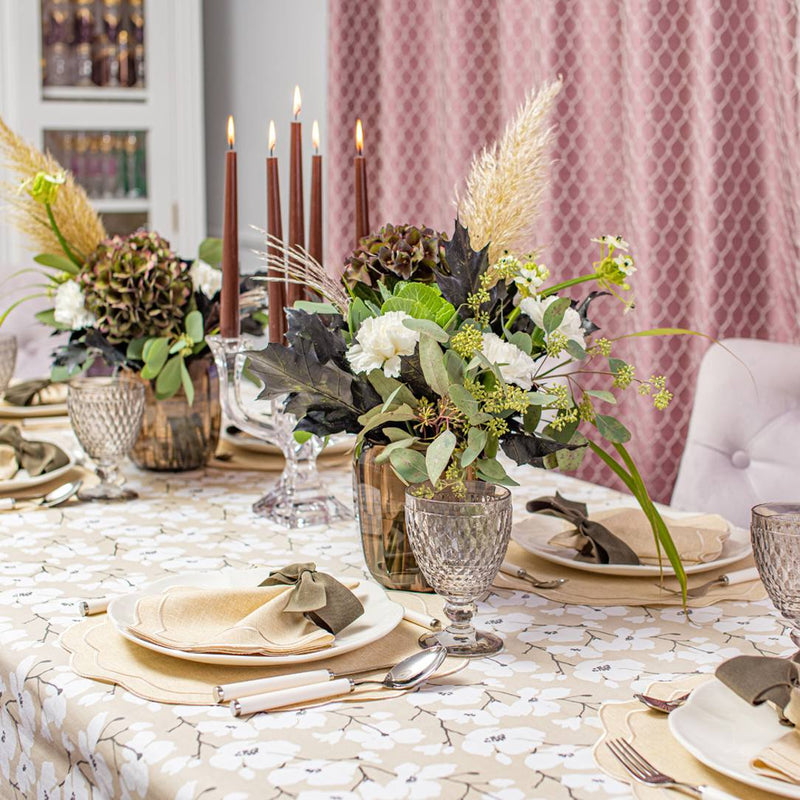 Beige Petali embroidered placemat with petal-shaped edges on fall floral tablescape.