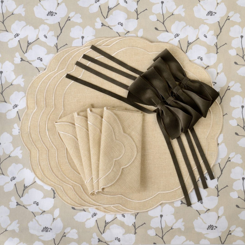 Beige Petali embroidered placemat with petal-shaped edges with matching accessories.