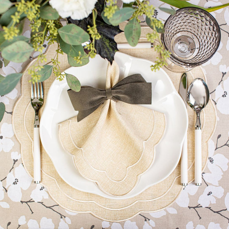 Beige Petali embroidered placemat with petal-shaped edges styled with matching napkin.