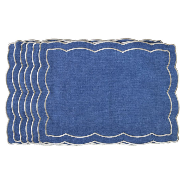 Blue fabric placemat embroidered with ecru thread and wave shape border by Roseberry Home.