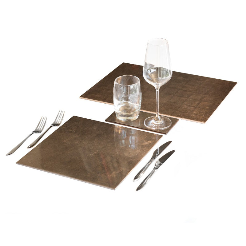 Taupe silver leaf placemat with polished lacquered finish with matching coasters.