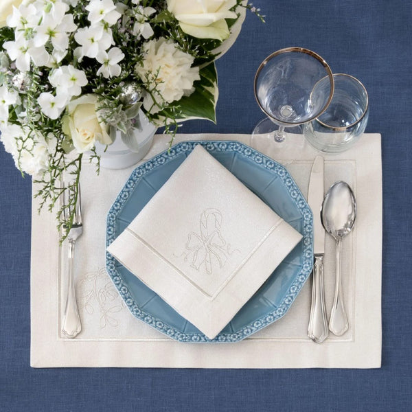 Silverline placemat with stitched border and candy cane design with matching napkin.