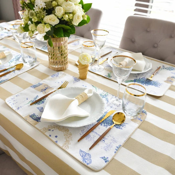 Reversible cotton placemat in lavender and beige side view on luxury tablescape.
