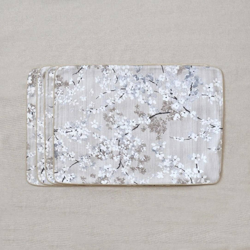 Double-sided cotton placemat set with gray twig embroidery and beige reverse, set of six.