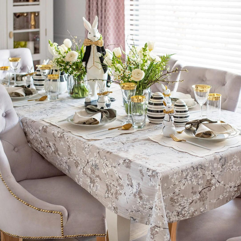 Double-sided cotton placemat set with gray twig embroidery and beige reverse on Easter table.